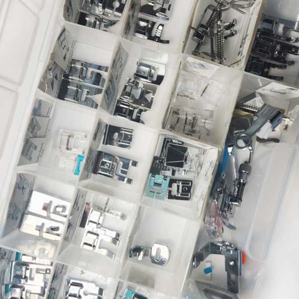 A basket of sewing machine parts