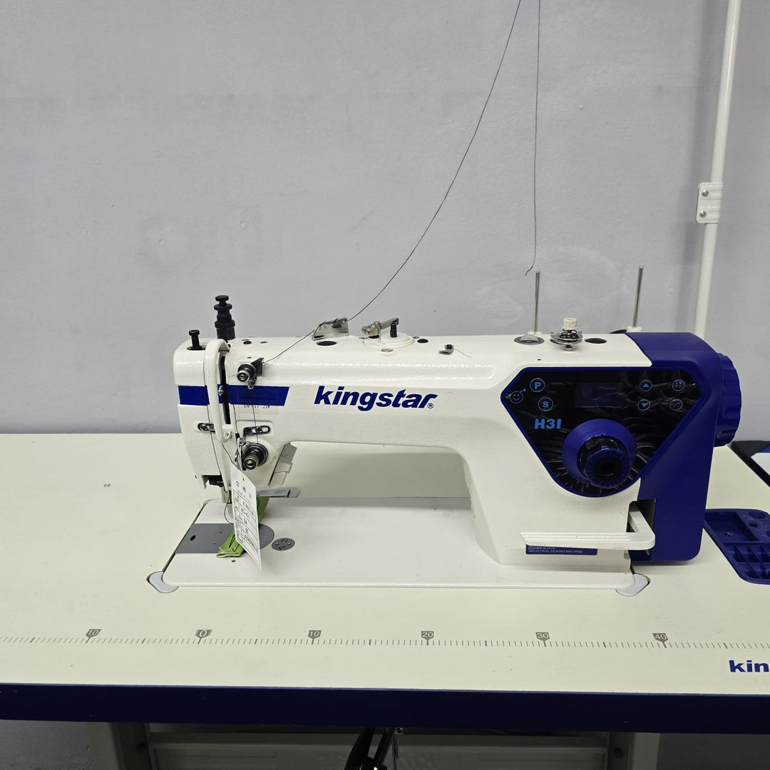 Kingstar sewing machine on a white table with a gray background